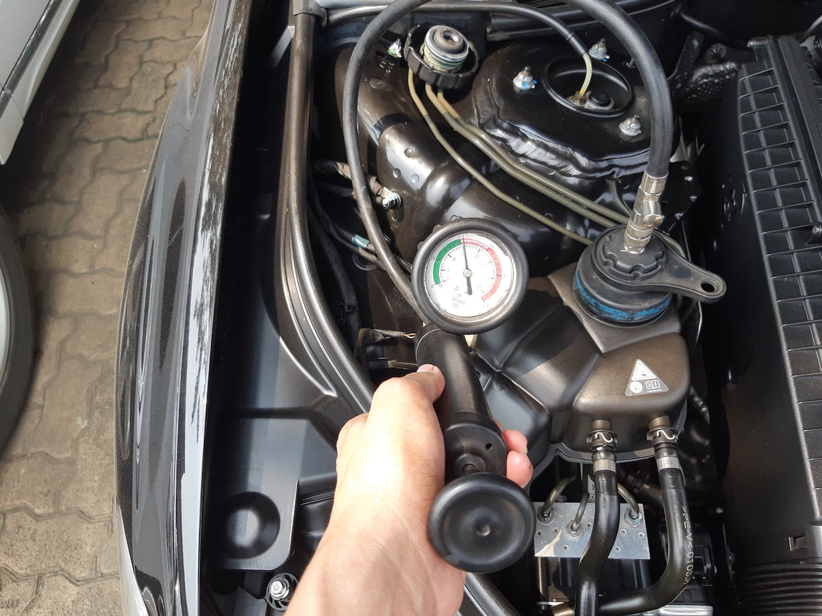 How to use a pressure tester to find a coolant leak
