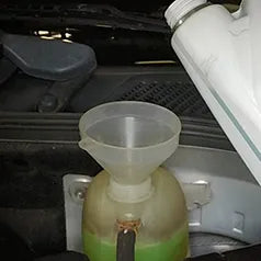 Engine coolant being added