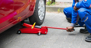 Car jack used to raise a car