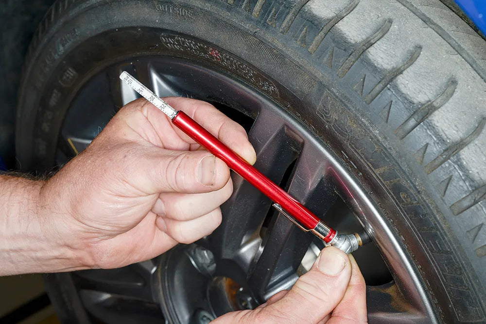 Using a tyre pressure gauge