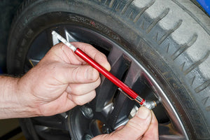 Using a tyre pressure gauge