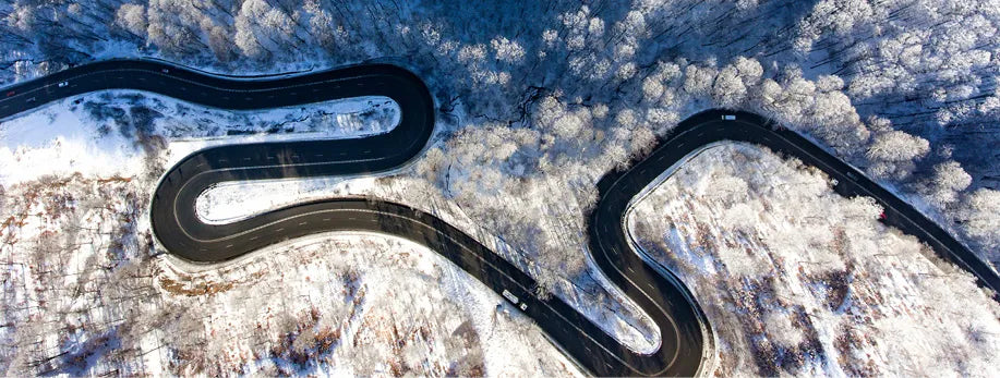An icy twisty road from above
