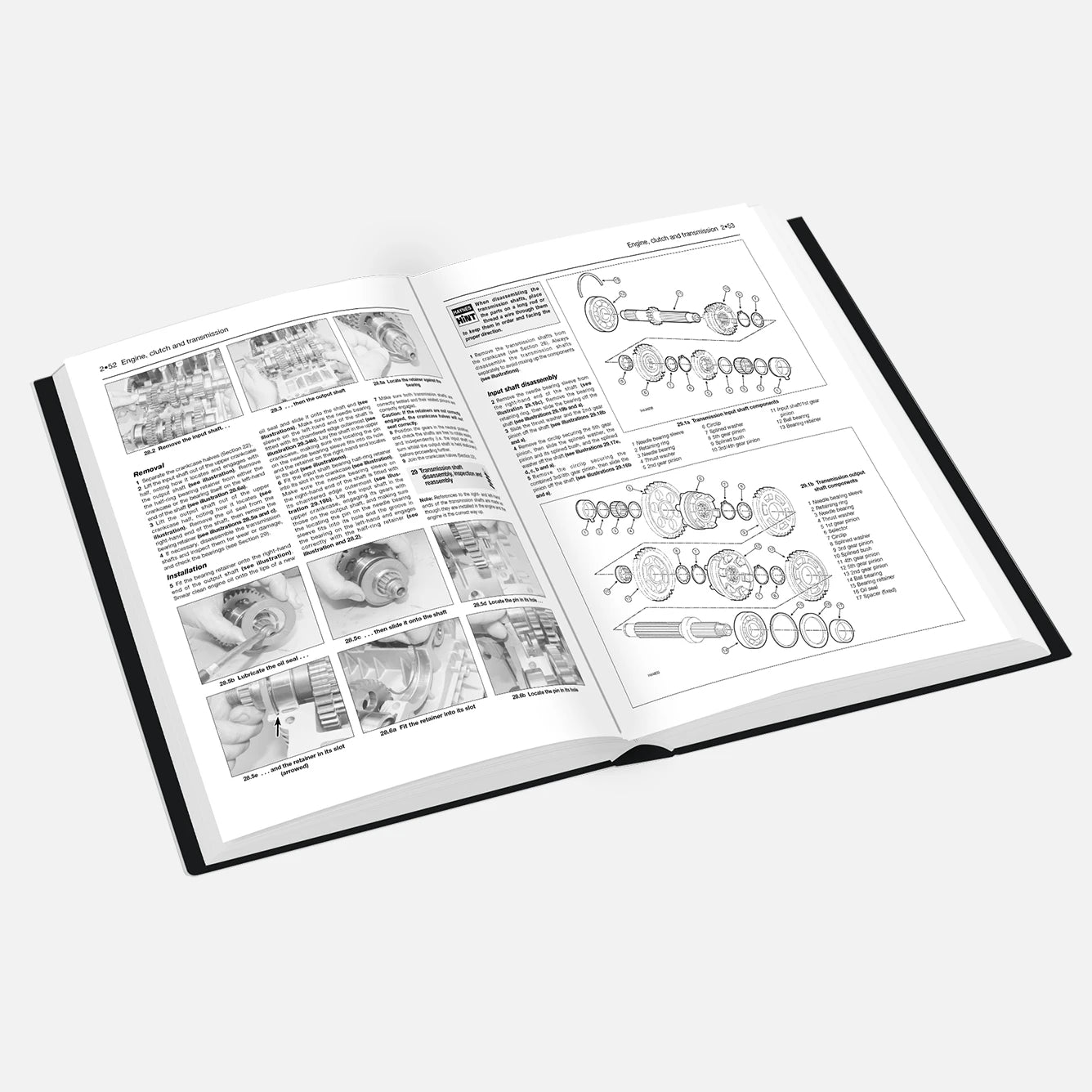 Open book with technical diagrams and text on a white background