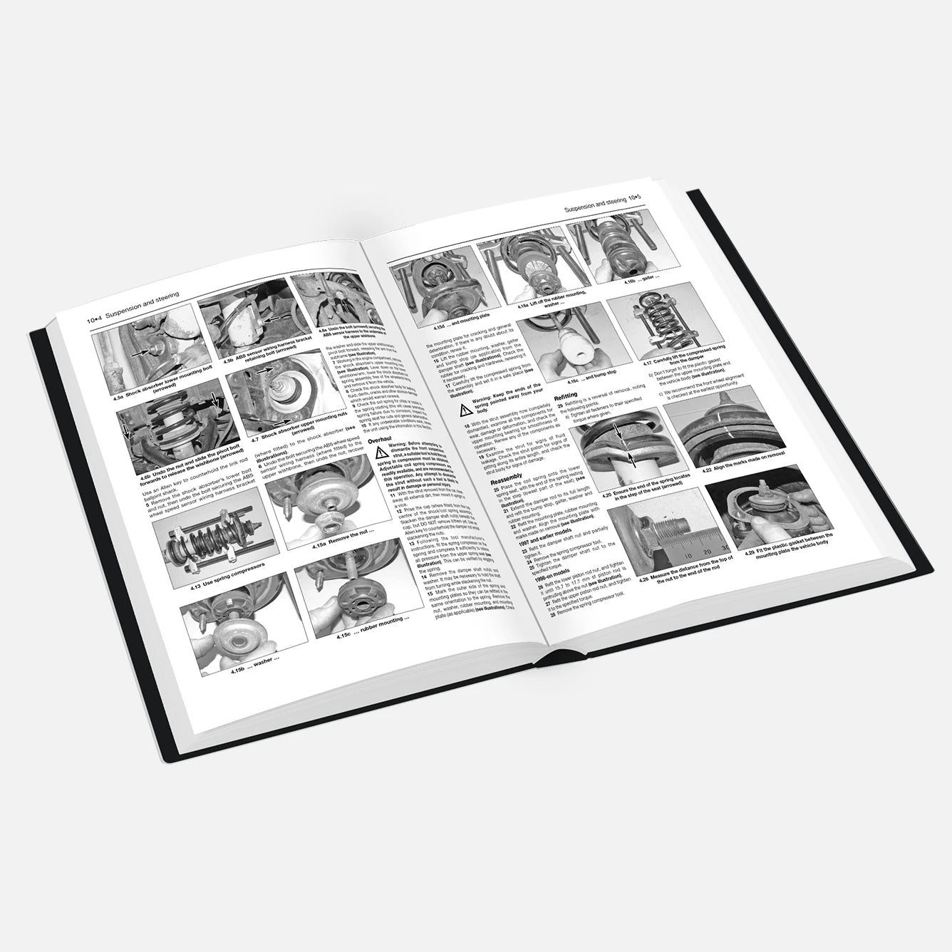 Open book with black and white illustrations and text on a white background