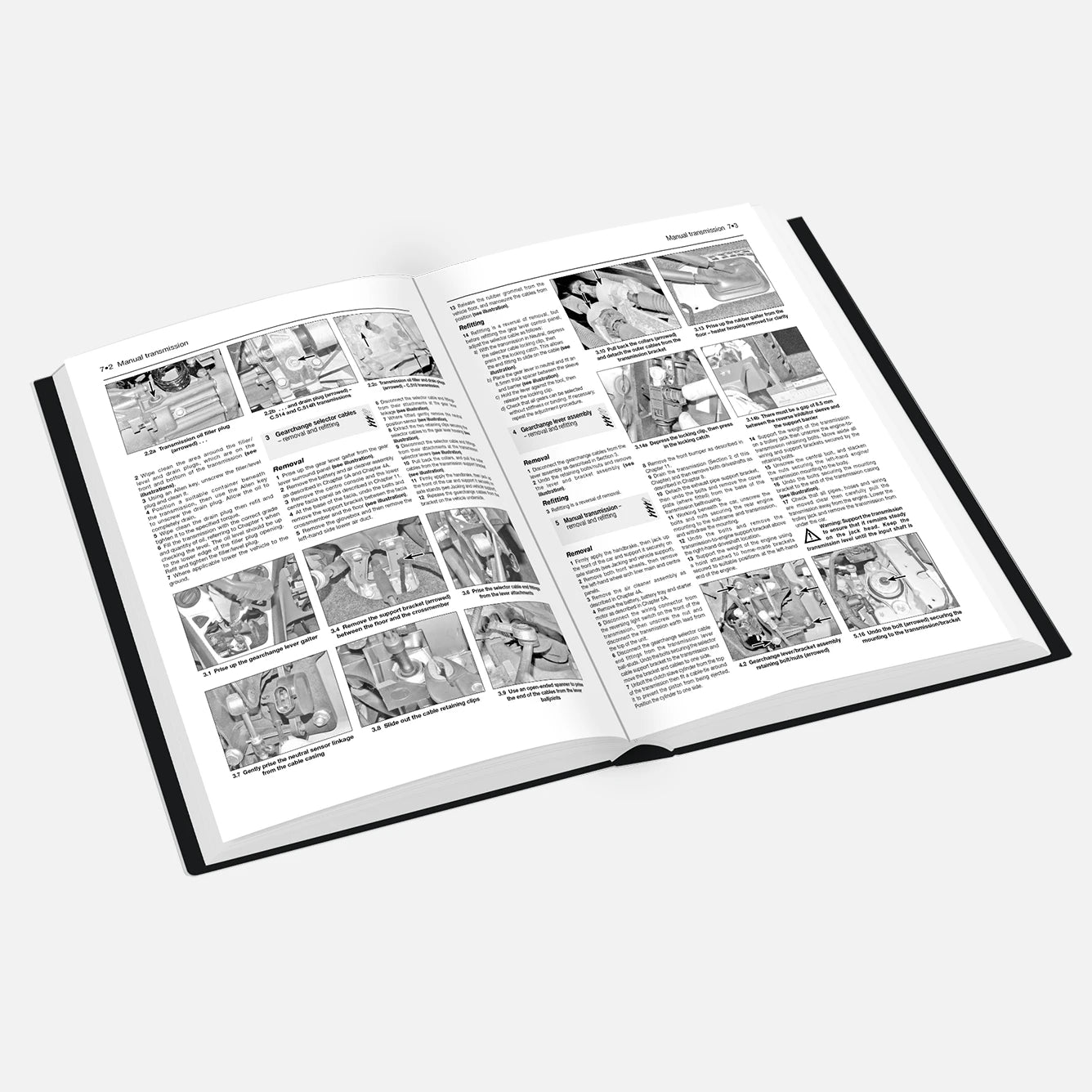 Open book with illustrations and text on a white background