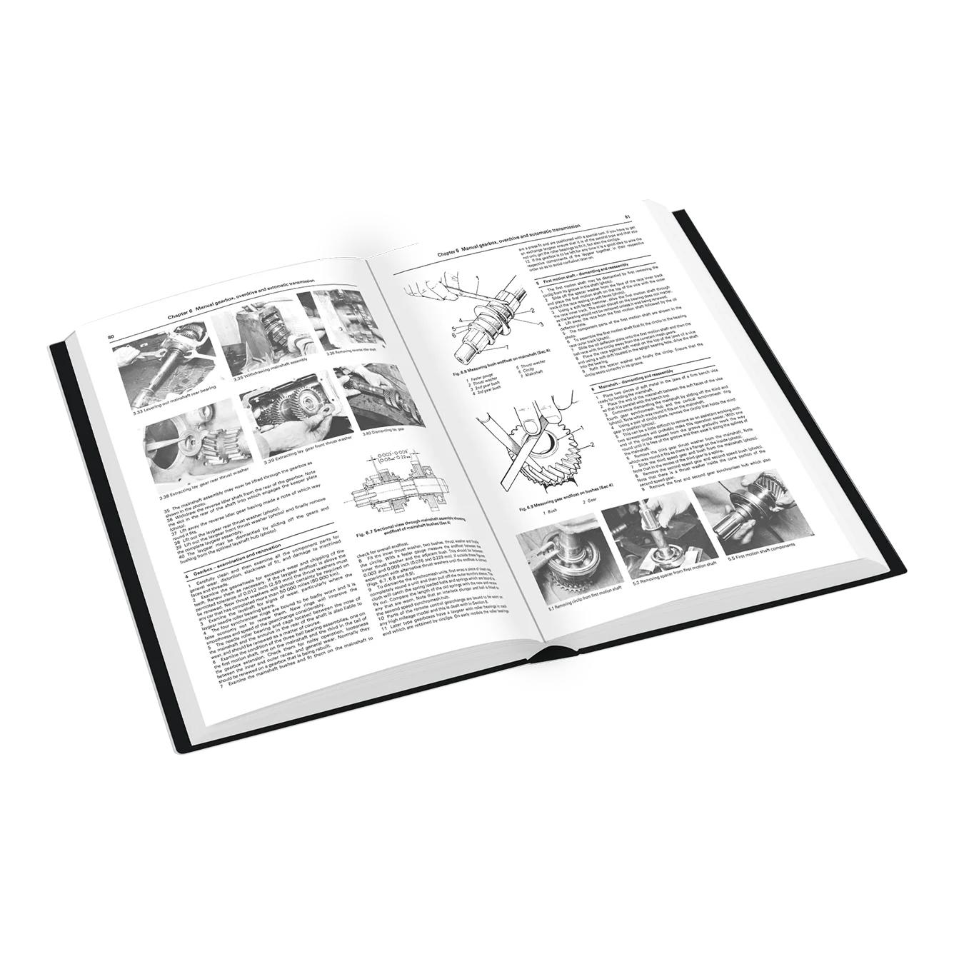 An open hardcover book with black-and-white technical pages, shown at an angle on a plain white background.