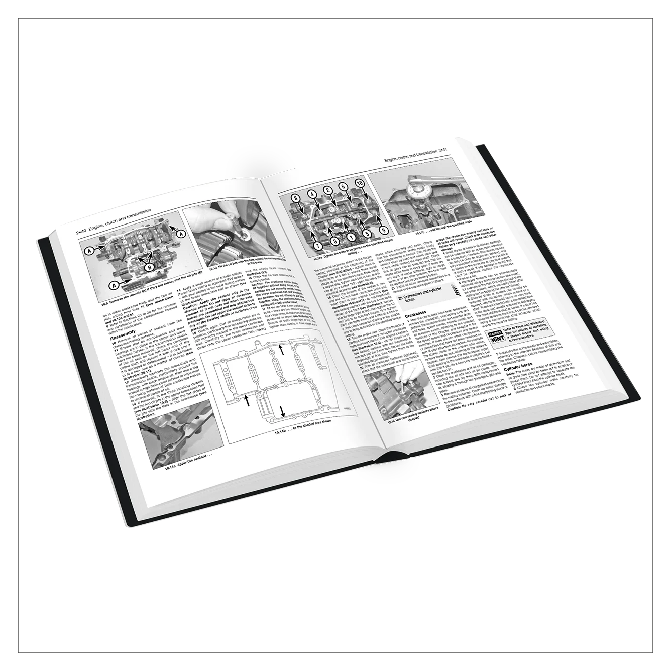 Open book with text and diagrams on a white background
