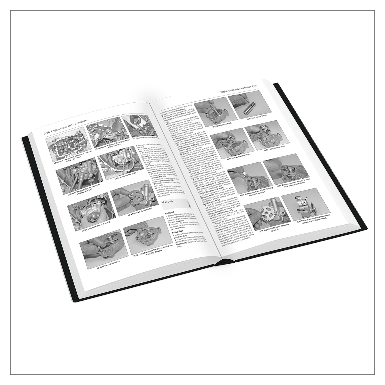 An open technical manual or service book showing grayscale pages with multiple small technical illustrations and blocks of text, photographed on a clean white background.