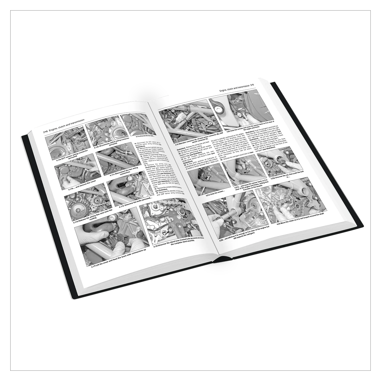 An open technical manual or book showing grayscale mechanical assembly diagrams and text pages, photographed on a clean white background.