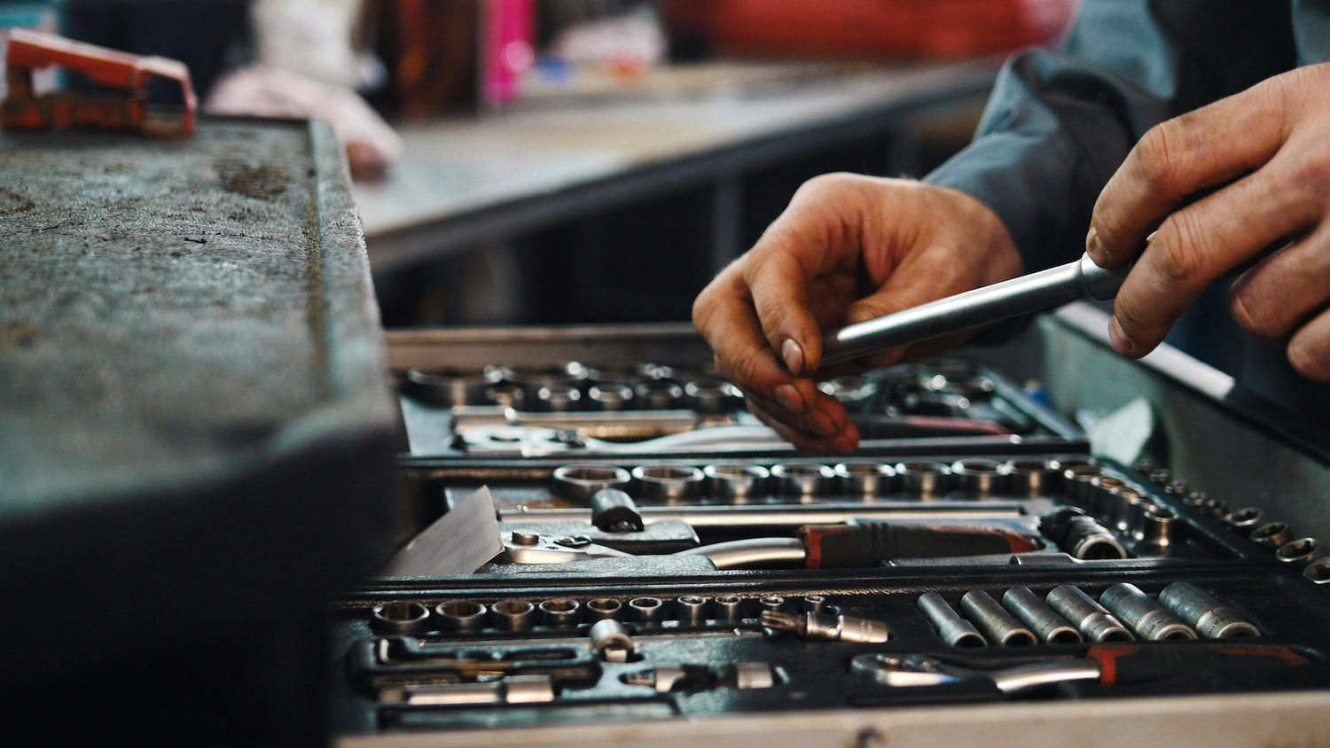 Person working with tools in a workshop setting